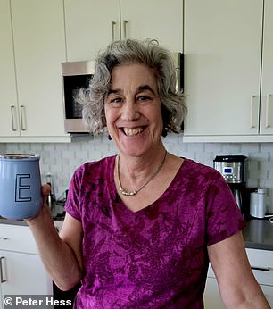 My mom, Erica, drinking a cup of tea in her kitchen and wearing her signature color